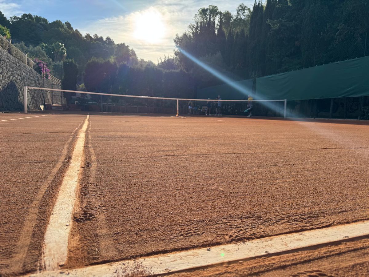 Morning sun over the hotel's clay court in Port Sóller
