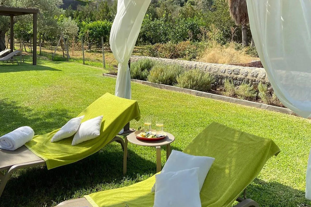 Daybeds in the hotel gardens, drinks served